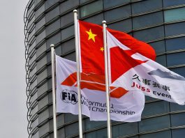 A Chinese flag alongside an FIA Formula 1 flag and a Juss Event
