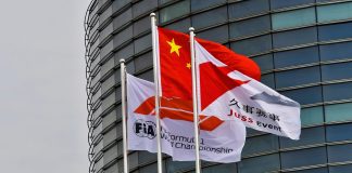 A Chinese flag alongside an FIA Formula 1 flag and a Juss Event